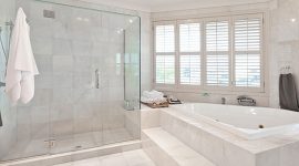 White concrete bathroom interior with white marble floors.