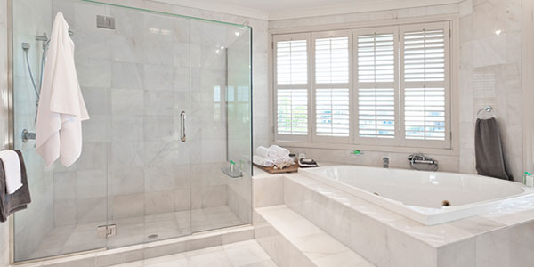 White concrete bathroom interior with white marble floors.